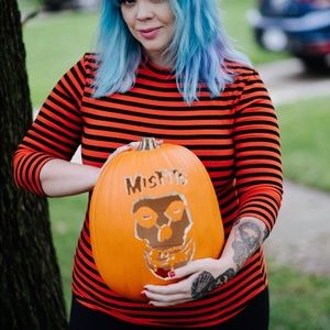 Vixen Micheline Pitt pin up girl clothing black and orange striped halloween